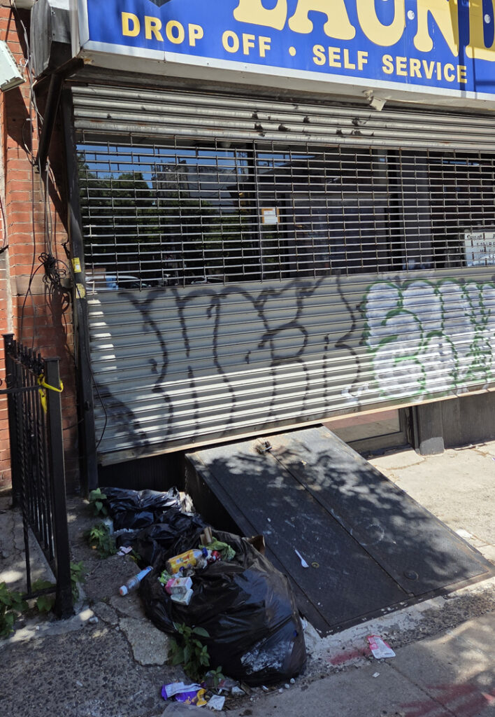 Mounds of trash outside 416 4th Avenue